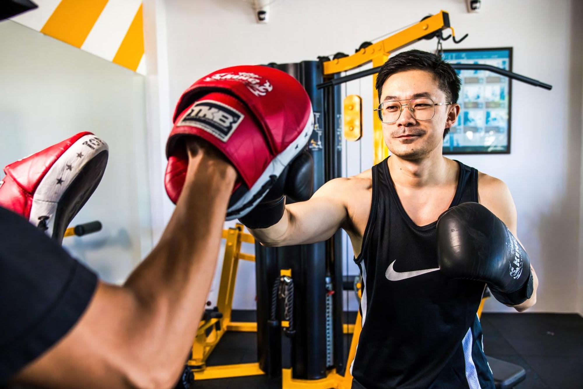 Grand Mercure Phuket Patong Exteriör bild A boxer training with a heavy bag