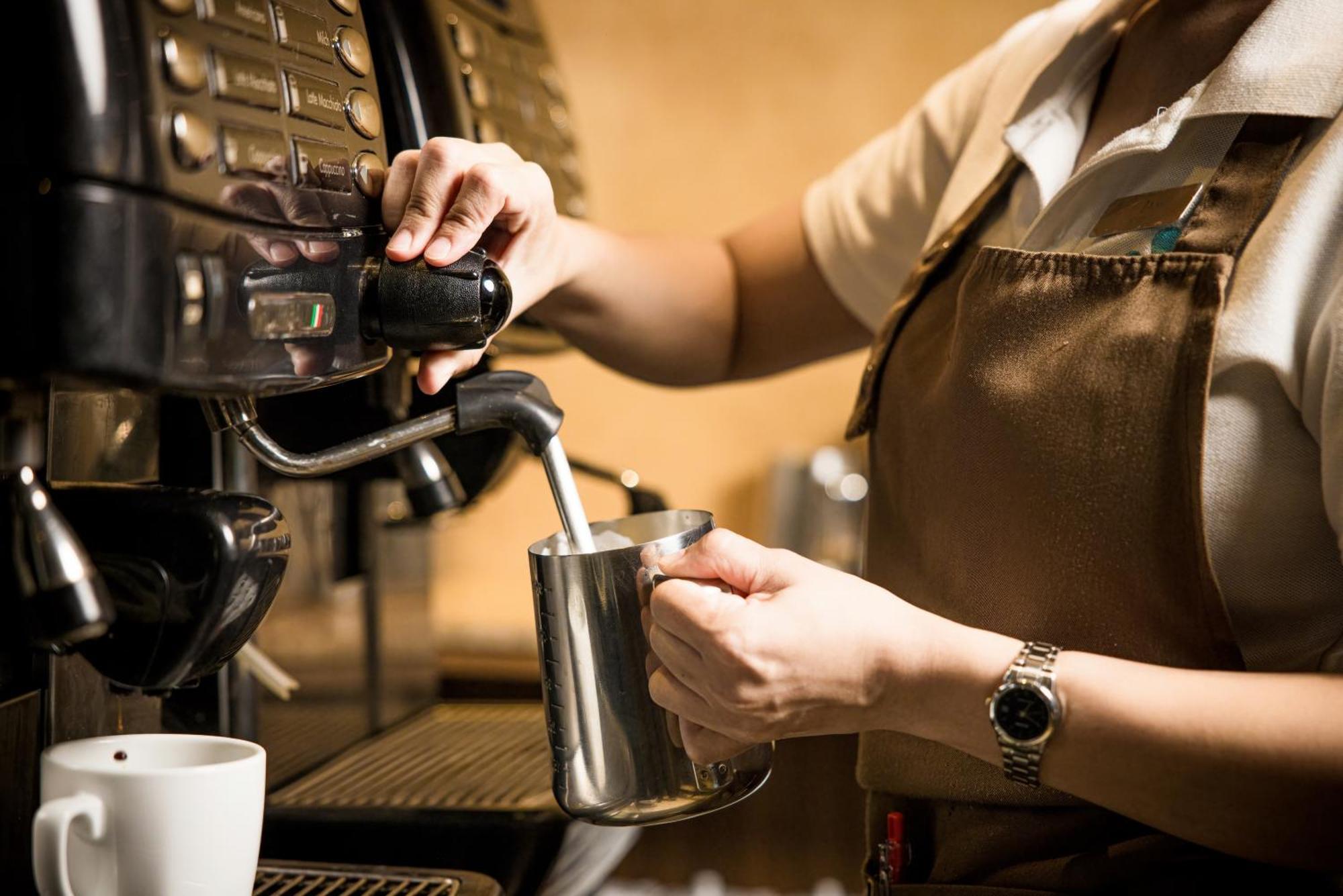 Grand Mercure Phuket Patong Exteriör bild A barista making coffee