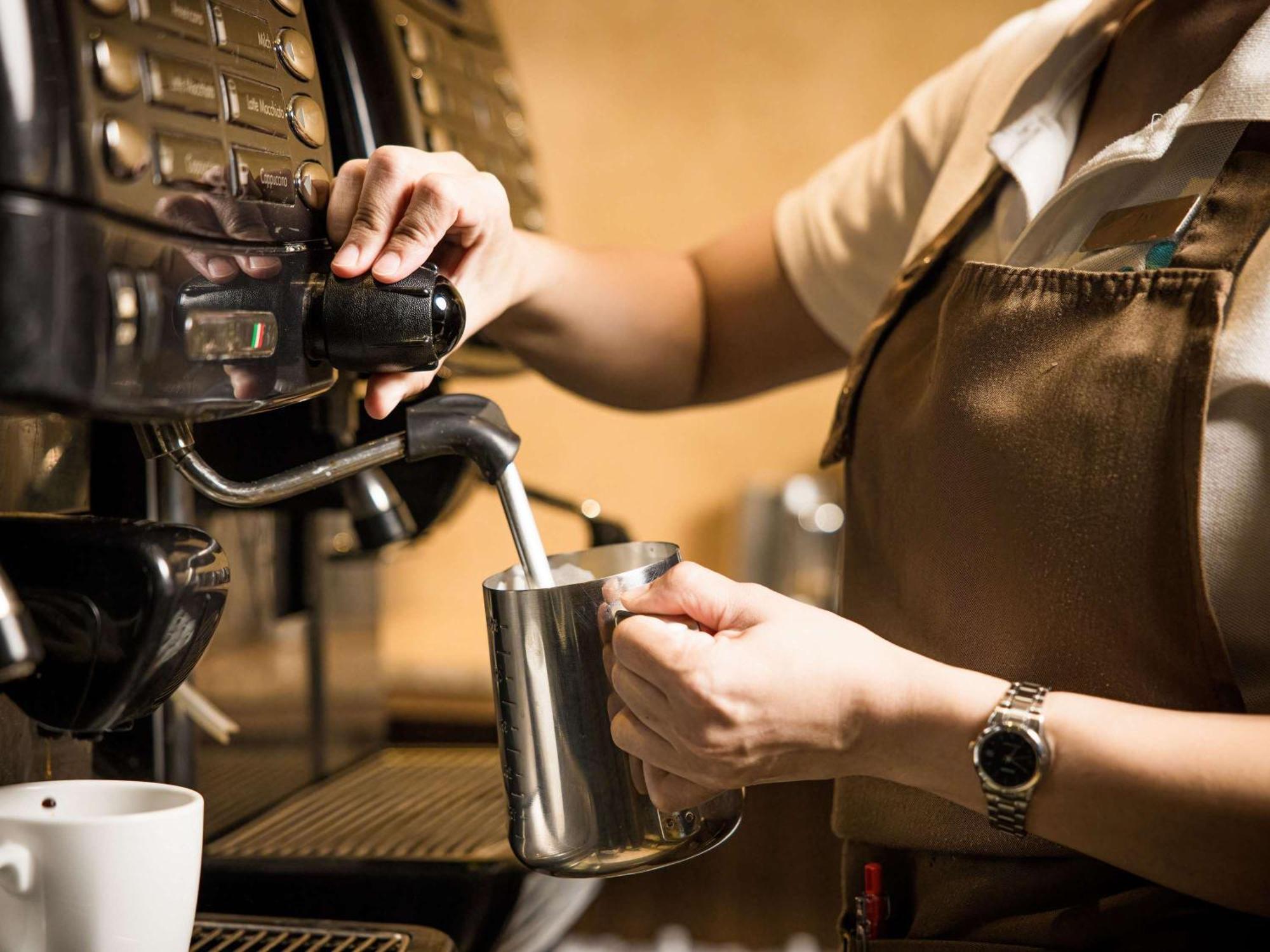 Grand Mercure Phuket Patong Exteriör bild A barista making espresso